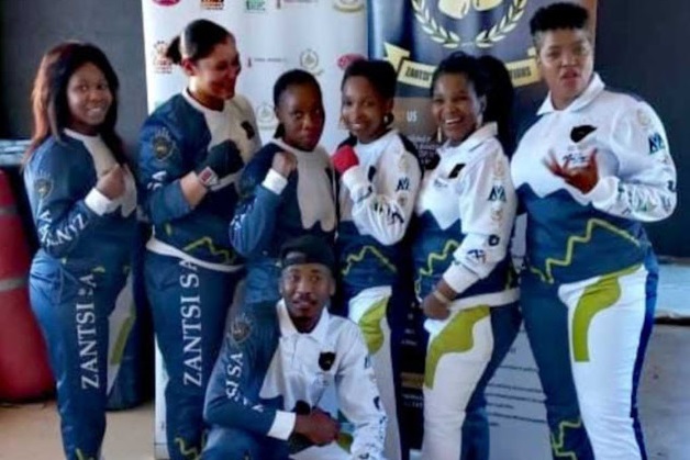 Promoter Mbali Zantsi back row right with fighters who be in action in her tournament on August 28.