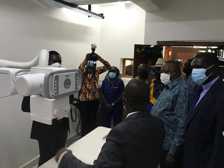 President Uhuru Kenyatta and Nairobi Metropolitan Service Director of Health Dr. Ouma Oluga during the launch of Newly built two Level Three Hospital in Kibera on Septmber 29, 2021