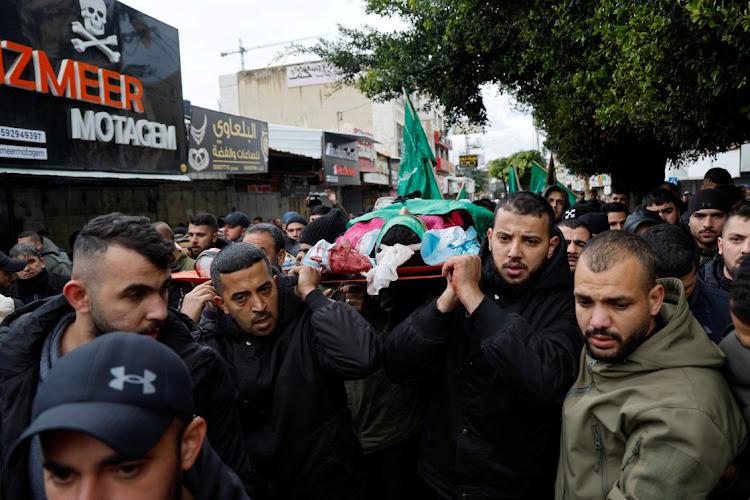 Mourners carry the body of a Palestinian that was killed during an Israeli raid in a hospital, in Jenin, in the Israeli-occupied West Bank on January 30, 2024. Picture: REUTERS/Raneen Sawafta