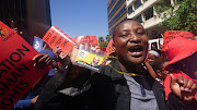 Marchers singing outside Cosatu house on Wednesday. 