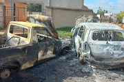 The two vehicles were torched by community members in Etwatwa.