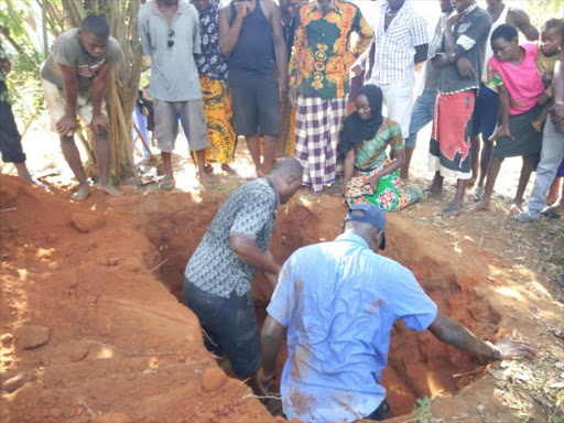 Family members digging up the grave of James Kahindi buried three years ago to confirm if he is still in the grave. The bizarre act took place on 25th November at Kayanda in Takaungu