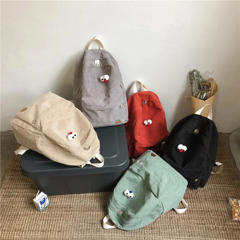 Mochila de veludo cotelê fofa e simples, perfeita para um visual fashion. Leve seus pertences com estilo e praticidade no dia a dia.