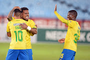  Gaston Sirino of Mamelodi Sundowns celebrates his goal with Kermit Erasmus and Neo Maema during the Nedbank Cup quarterfinal match against Summerfield Dynamos at Loftus Versfeld Stadium on April 9.