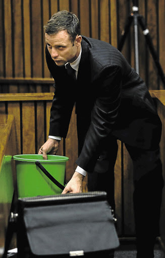 PREPARED: After throwing up during evidence about Reeva Steenkamp's fatal wounds, Oscar Pistorius had a bucket ready