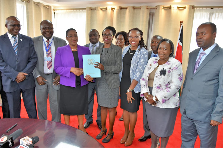 Health CS Sicily Kariuki (third from left) and chairperson Nursing Council Eunice Ndirangu at Afya House on July 19, 2019