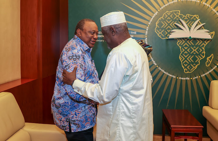 Former President and EAC Facilitator for the Nairobi Peace Process on the Peace and Stability in the Eastern DRC Uhuru Kenyatta and AU Chairperson Moussa Faki Mahamat during the 1st Strategic Reflection on Implementation of Cessation of Hostilities Agreement on March 11, 2024.