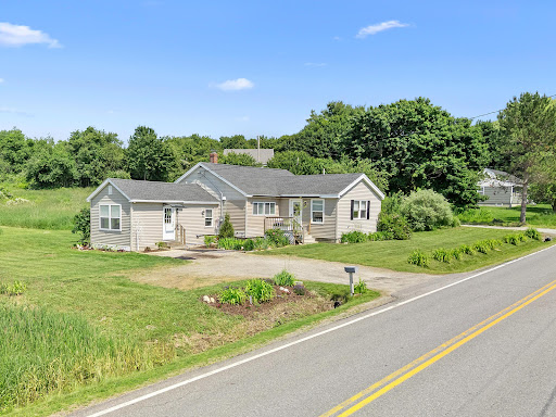 Ranch house with green lawn in this luxury house for sale in Rockland ($399,000)