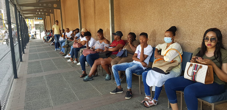 People queue at the Master's Office in Pretoria. Some are returning to enquire about their claims or try to obtain a letter of executorship.