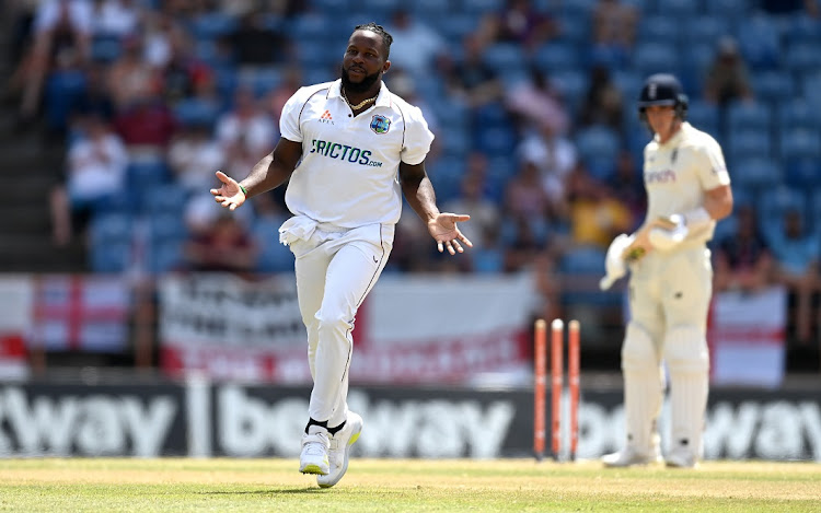 Kyle Mayers of the West Indies celebrates dismissing Dan Lawrence of England on day three of the third Test at National Cricket Stadium in Grenada on March 26 2022.