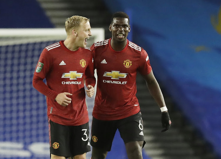 Manchester United’s Paul Pogba celebrates scoring with new signing Donny van de Beek during their English League Cup win over Brighton & Hove Albion at The American Express Community Stadium, Brighton, on Wednesday