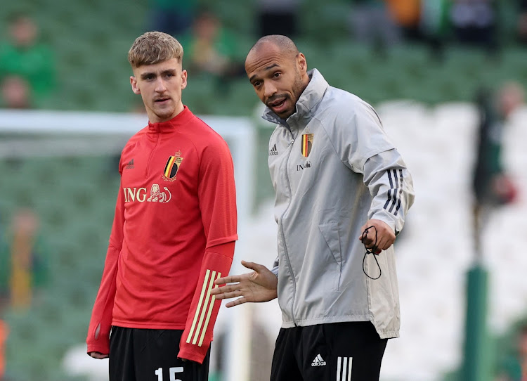 Belgium assistant coach Thierry Henry with Alexis Saelemaekers before the match