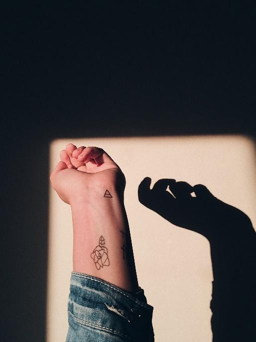 A picture containing tattoo, feet

Description automatically generated