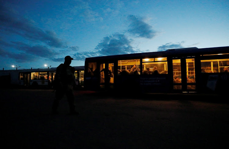 Service members of Ukrainian forces who have surrendered after weeks holed up at Azovstal steel works are seen inside a bus, which arrived under escort of the pro-Russian military at a detention facility in the course of Ukraine-Russia conflict in the settlement of Olenivka in the Donetsk Region, Ukraine May 17, 2022.