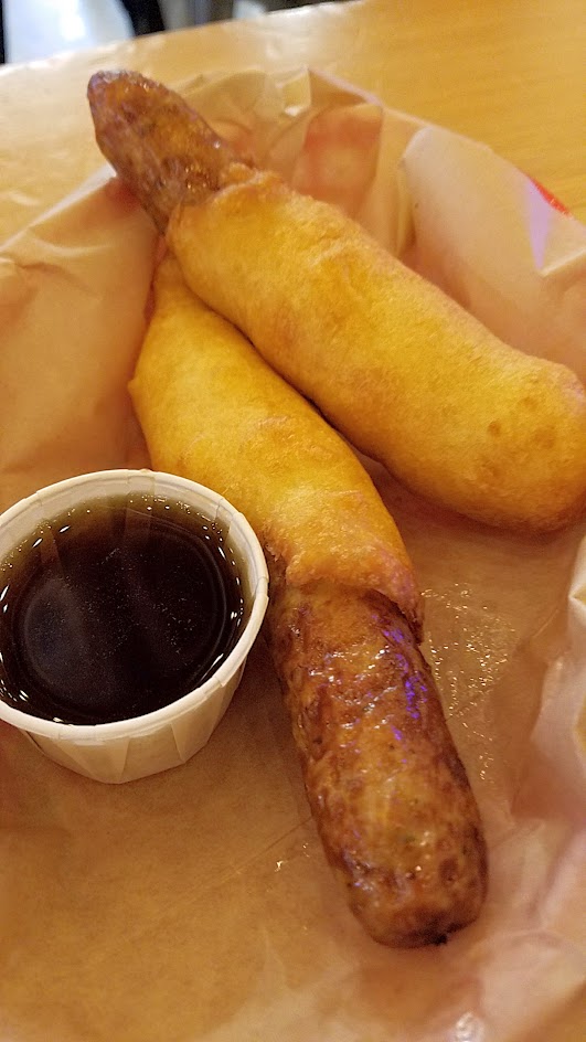 Brunch at Pine Street Market includes OP Wurst with their four breakfast hot dogs, such as this Pigs In A Blanket with two breakfast sausages, pancake blanket, maple syrup