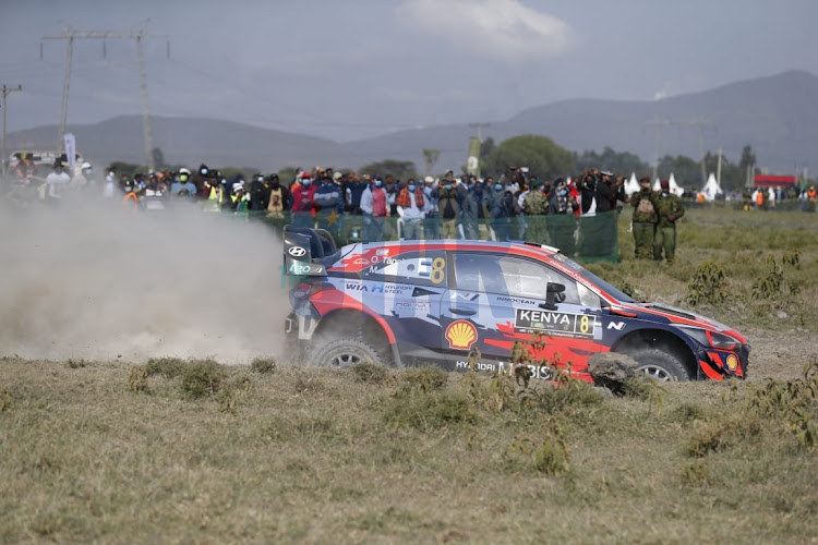 Thierry Neuville navigated by Martijn Wydaeghe driving Hyundai Shell Movie team power through kedong spectator stage in Naivasha.