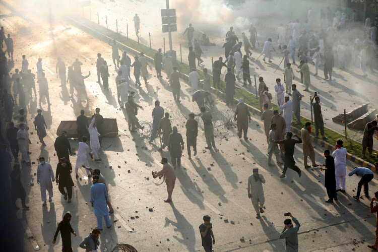 Supporters of Pakistan's former prime minister Imran Khan participate in a protest against his arrest, in Peshawar, Pakistan, May 9 2023. Picture: FAYAZ AZIZ/REUTERS