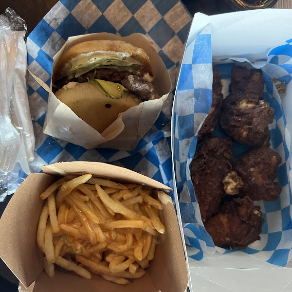 Mushroom swiss burger, cheese fries and wings