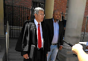 Hlumelo Biko, right, with his lawyer Roy Barends outside Cape Town Magistrate's Court yesterday after a complainant 'close' to him laid a charge of assault.  / Philani Nombembe