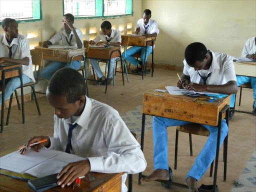 Form four candidates of Garissa high school sit for their KCSE mathematics paper./FILE