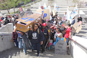 Reclaim the City activists march to the Civic Centre in Cape Town to protest against Mayor Dan Plato's housing policies.