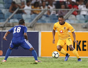 Bernard PArker takes on Bounard Touvounel during the CAF Confederation Cup match between Kaizer Chiefs and Elgeco Plus FC at Moses Mabhida Stadium on December 15, 2018 in Durban, South Africa. 