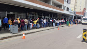 Shoppers queue outside a shoe store in the Pretoria CBD shoppers on Black Friday.