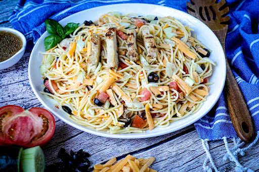 A serving bowl of Summer Spaghetti Salad with Grilled Chicken.