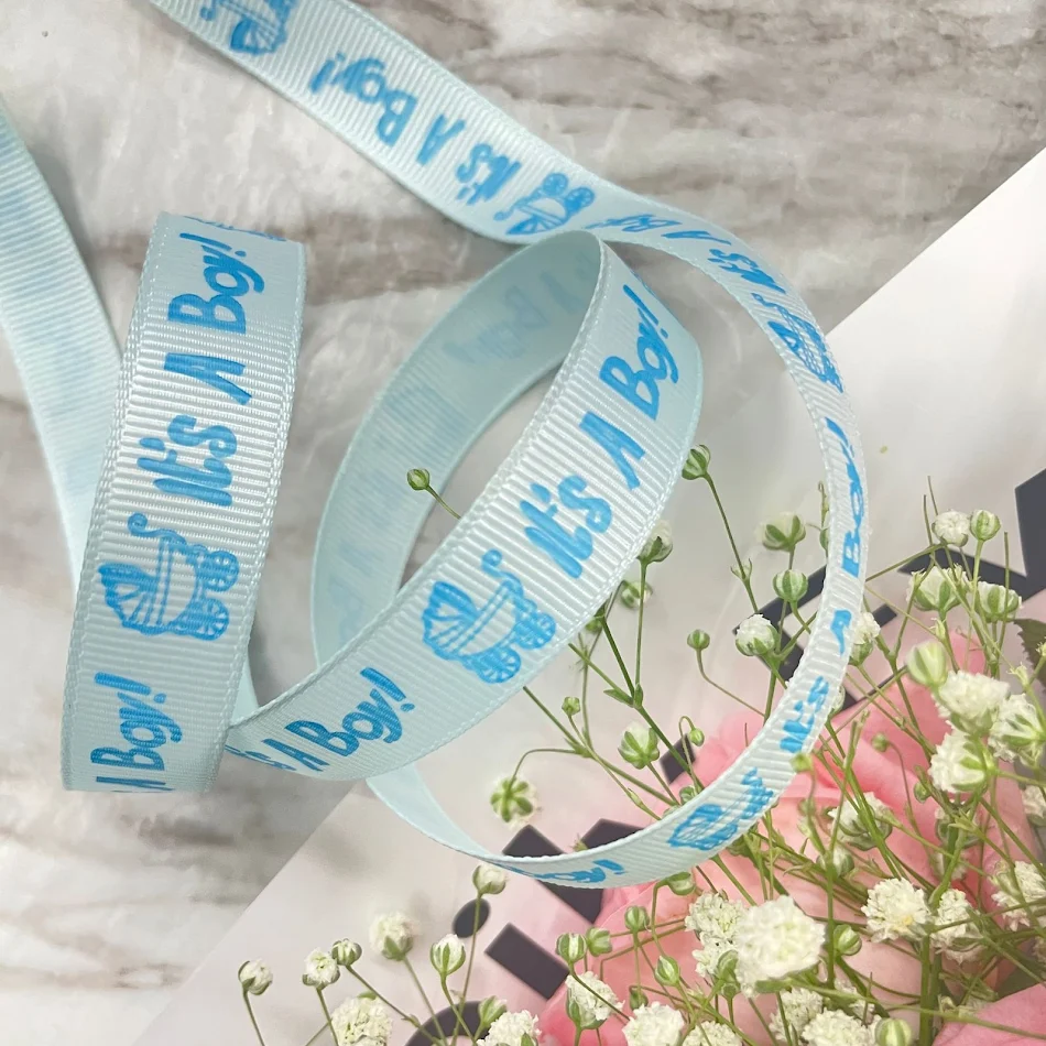 Ruban imprimé coloré pour bébés, idéal pour le DIY et l'emballage de biberons. Parfait pour personnaliser vos créations.