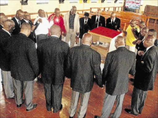 FATHER FOCUS: Men's Prayer League members in deep prayer at the Lutheran Church in Central Western Jabavu, Soweto, at the weekend PHOTO: VICTOR MECOAMERE