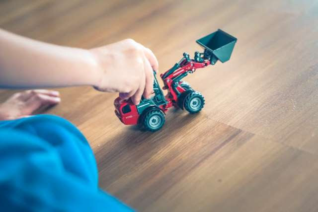 Child Playing Front Loader Toy