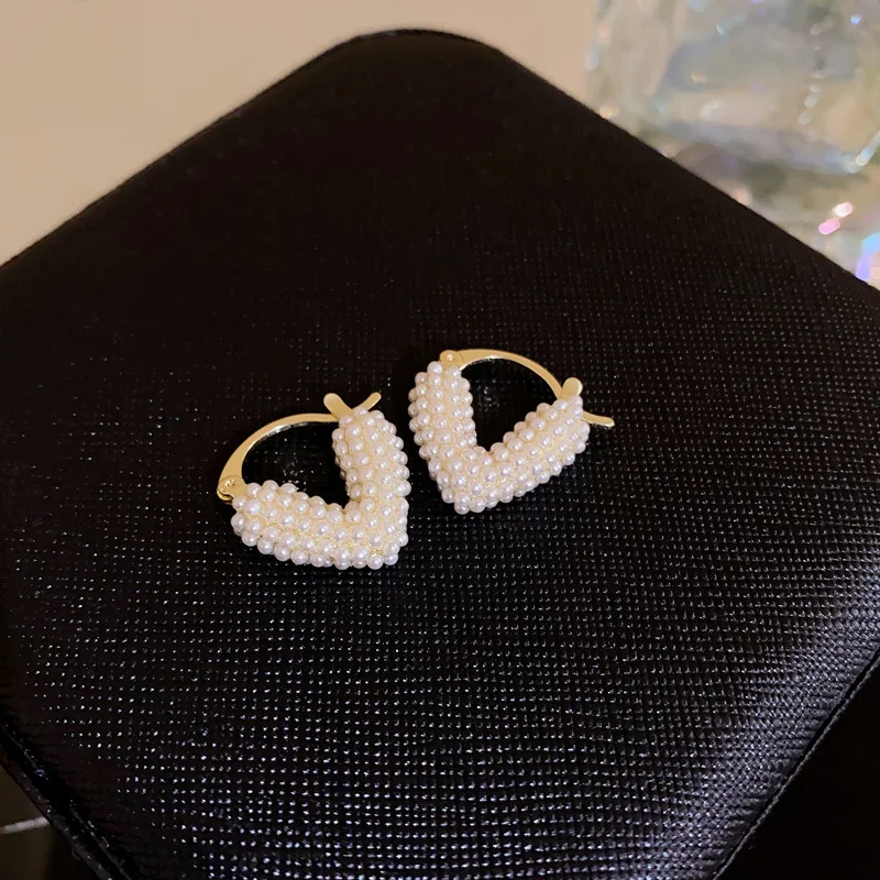 Geavanceerde gepersonaliseerde damesoorbellen met parelhart, rijstkorrelkralen, uniek design en tijdloze elegantie