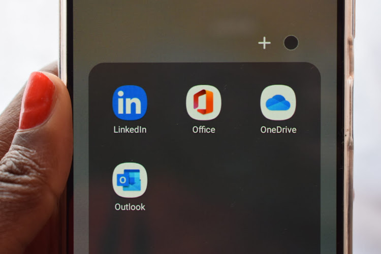 A person loads the original LinkedIn app on phone