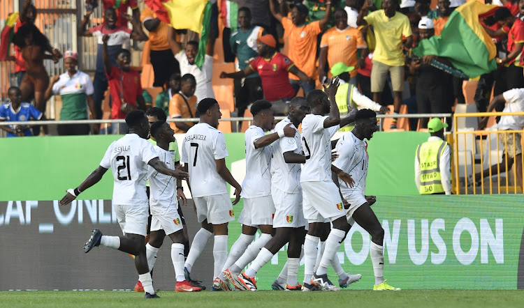 Guinea players celebrate during their match against Cameroon