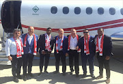 Newly signed Antalyaspor striker Samuel Eto'o arrives at Ataturk Airport in Istanbul alongside club President Gideon Gencer and Board of Directors on 24 June 2015.