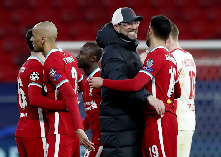 Liverpool manager Jurgen Klopp celebrates with players after their Champions League round of 16 second leg win over RB Leipzig at Puskas Arena, Budapest on March 10, 2021