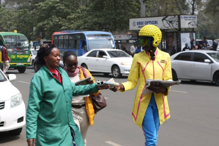 A Timeless Warrior distributes ‘Form ni Gani’ newspapers to wananchi