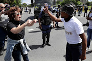 Police attempt to control the crowd as parents and Brackenfell residents go head-to-head with members of the EFF in Cape Town.