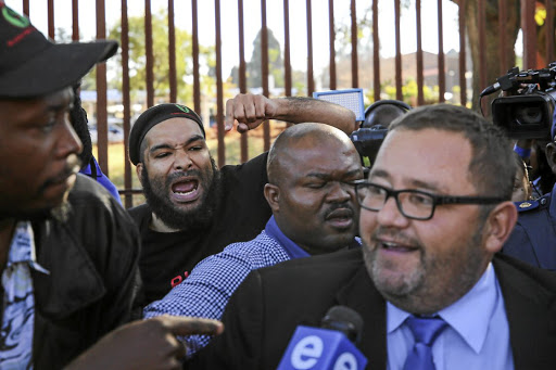 Members of the Black First Land First heckle AfriForum chief executive officer Kallie Kriel.