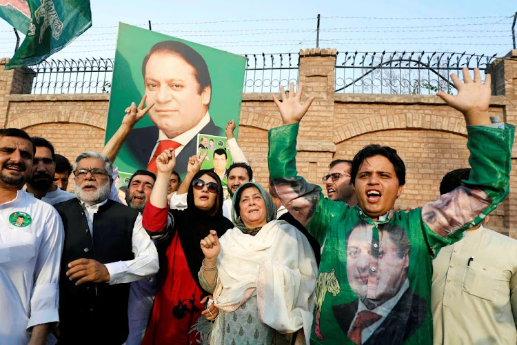 Supporters of former Prime Minister Nawaz Sharif react as they celebrate following the court's decision in Peshawar, Pakistan, on September 19 2018.