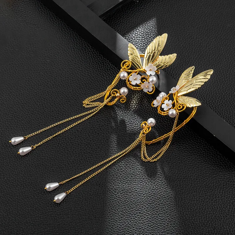 Lange oorbellen met vlindervleugels en kwastjes, antiek, clip, voor een vleugje vintage elegantie en comfort.