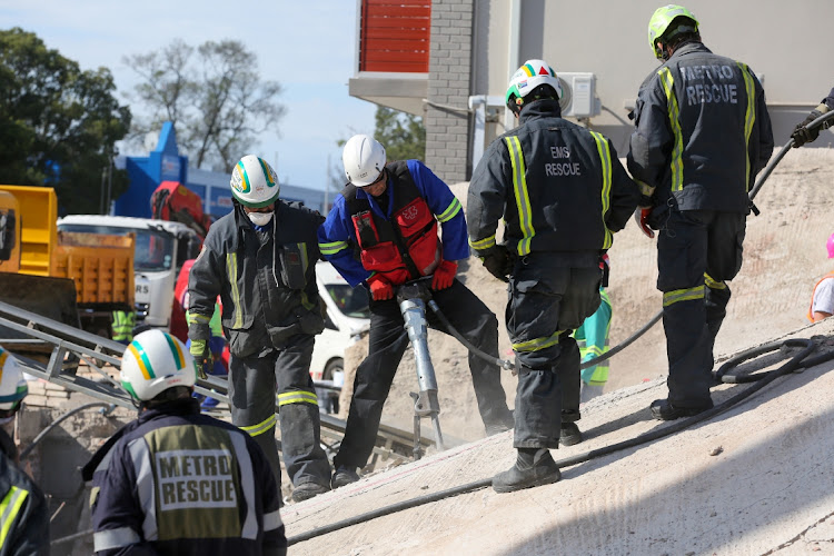 Rescue workers continued to scour the rubble of the collapsed building in Victoria Street on Wednesday, trying to recover workers presumed trapped in the debris. About 75 construction workers were on site when the building collapsed at about 2pm on Monday.