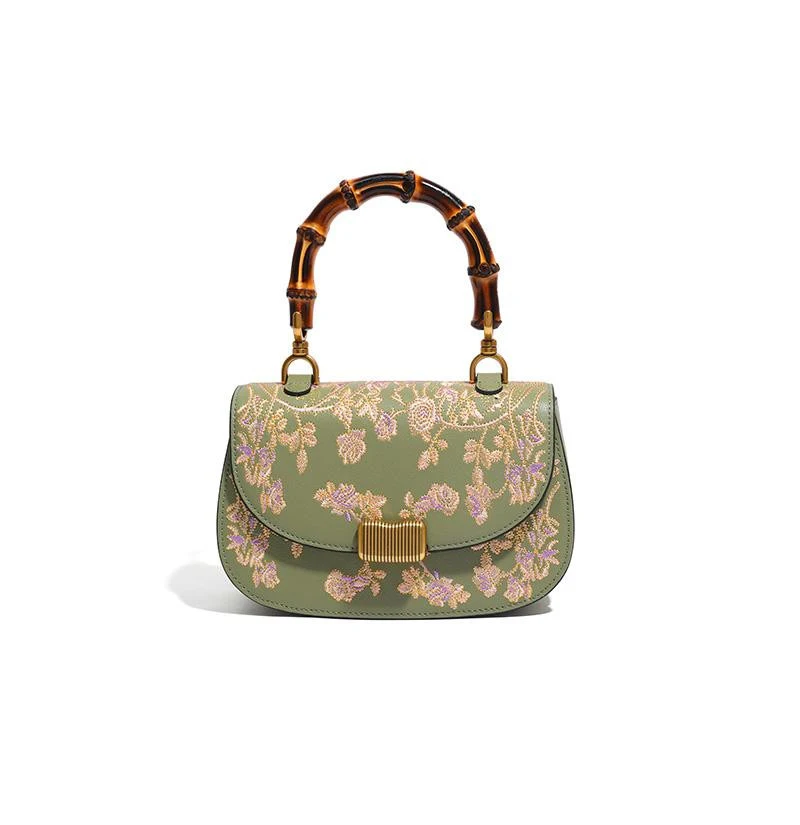 Dames bamboe handtas met koeienhuid borduurwerk. Elegantie en stijl. Perfect voor vrouwen die op zoek zijn naar een uniek en verfijnd accessoire.
