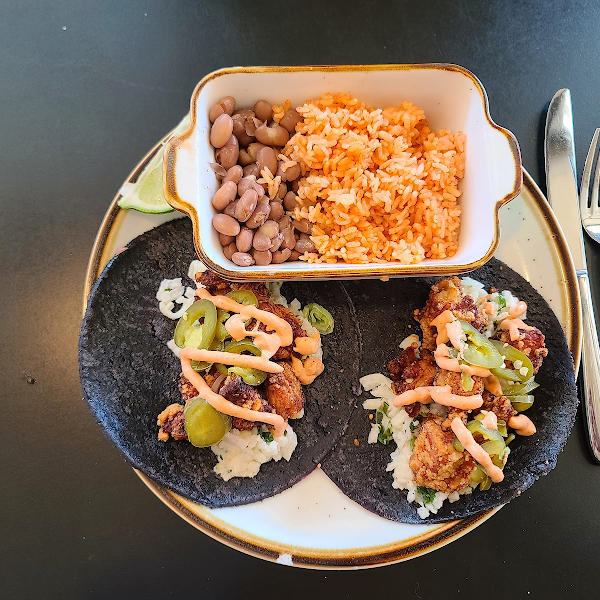 Popcorn chicken tacos and queso fundita