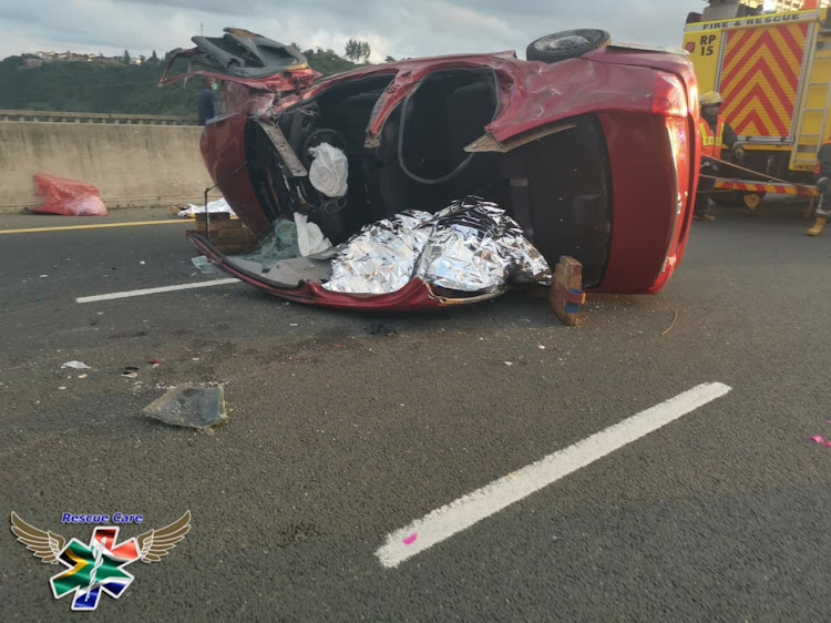 The scene of a fatal crash in which a single vehicle lost control and rolled several times. Seven people have lost their lives