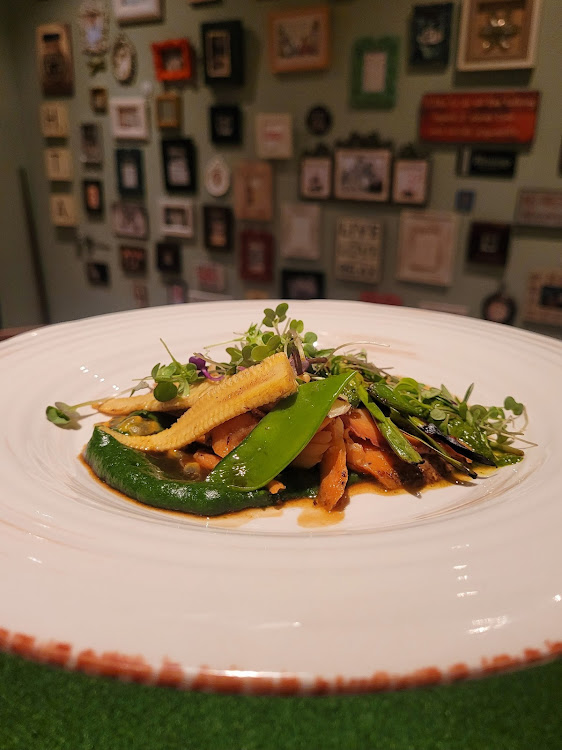 Orange baked salmon, baby potato galette, spinachpuree, mixed vegetables, charred scallion, granadilla chermoula,