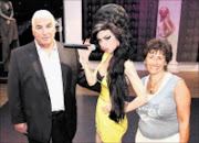 FAMILY PAIN: Amy Winehouse's parents Mich, left, and Janice unveil a waxwork figure of Grammy Award winning singer Amy Winehouse at Madame Tussauds in London, England.  23/07/2008. Pic. Dan Kitwood.  © Getty Images.