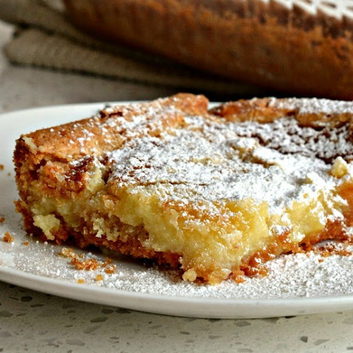 This family friendly Gooey Butter Cake has seven ingredients and takes less than ten minutes to get in the oven.