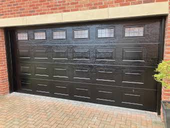 Sectional Overhead Insulated Garage Doors. album cover