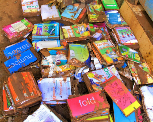 Smudged books outside a muddy classroom at Mathare North Primary School affected by floods, May 3, 2024.